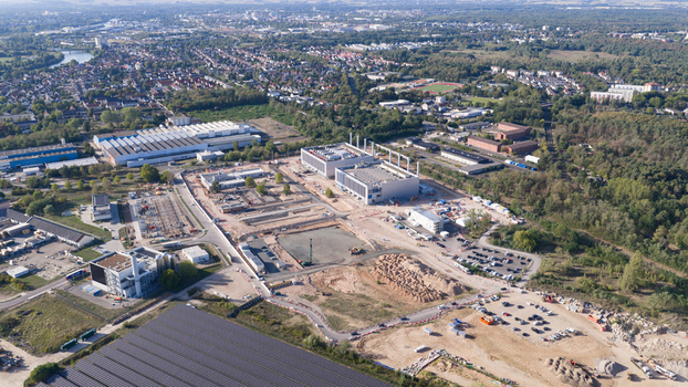 Aerial view of the Data4 Hanau data center construction site featuring large industrial buildings heavy machinery and surrounding urban landscape in Hanau Hessen Germany. Aerial view of the Data4 Hanau data center construction site featuring large industrial buildings heavy machinery and surrounding urban landscape in Hanau Hessen Germany.