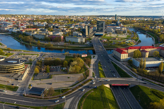 Vilnius County Lithuania 01 May 2026 Aerial view of the Neris river winding through the urban landscape with modern skyscrapers bridges and green riverbanks in the city center. Vilnius County Lithuania 01 May 2026 Aerial view of the Neris river winding through the urban landscape with modern skyscrapers bridges and green riverbanks in the city center.