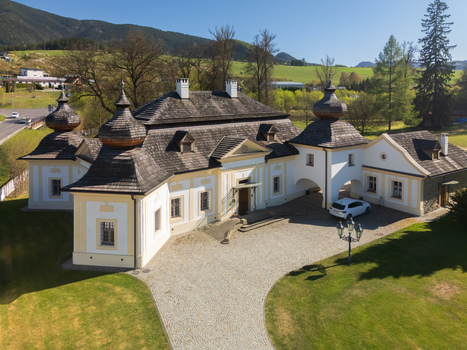 Aerial view of the historic Kastiel Kubinyi manor house with traditional shingle roofs and elegant architecture surrounded by green lawns Vysny Kubin Zilinsky kraj Slovakia. Aerial view of the historic Kastiel Kubinyi manor house with traditional shingle roofs and elegant architecture surrounded by green lawns Vysny Kubin Zilinsky kraj Slovakia.