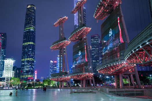 Guangzhou China 23 February 2024 View of the illuminated Haixin Bridge and the towering Canton Tower at night in the modern skyline of Guangzhou. Guangzhou China 23 February 2024 View of the illuminated Haixin Bridge and the towering Canton Tower at night in the modern skyline of Guangzhou.