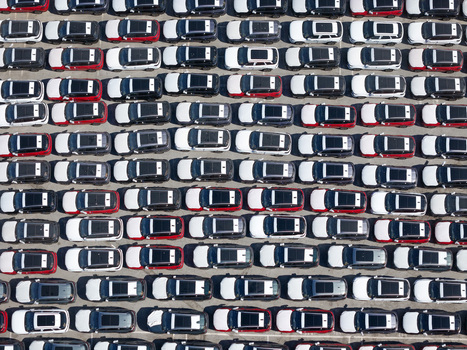 Aerial view of rows of parked cars in a large lot in Vado Ligure Liguria Italy.