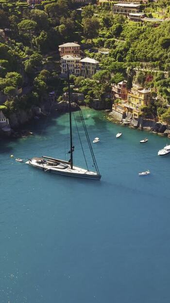 Aerial view of a sailboat in the bay of Portofino Italy.