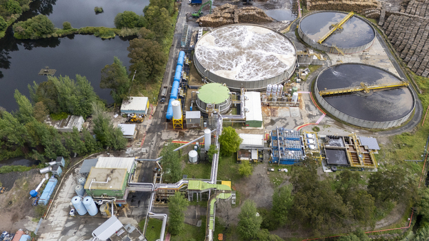 Aerial view of the Biofabrica de Ence en Pontevedra industrial facility featuring large circular settling tanks and complex piping systems Pontevedra Pontevedra Spain. Aerial view of the Biofabrica de Ence en Pontevedra industrial facility featuring large circular settling tanks and complex piping systems Pontevedra Pontevedra Spain.