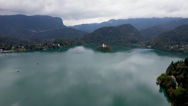 Aerial view of Lake Bled with the island church and mountains Slovenia.