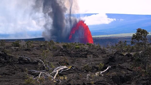 Aerial view of a volcanic eruption with a lava fountain.