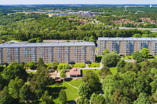 Aerial view of Rannebergen residential area featuring large apartment blocks surrounded by lush green forests and parkland in Gothenburg Vastra Gotaland County Sweden. Aerial view of Rannebergen residential area featuring large apartment blocks surrounded by lush green forests and parkland in Gothenburg Vastra Gotaland County Sweden.