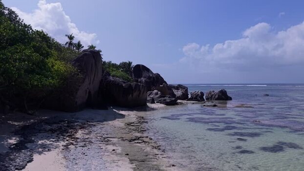 Aerial view of Anse Reunion beach with granite boulders Seychelles.