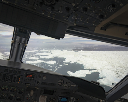 Aerial view of a breathtaking expanse of icy waters viewed from a plane s cockpit where the stark white ice meets the deep blue sea Narsarsuaq Greenland. Aerial view of a breathtaking expanse of icy waters viewed from a plane s cockpit where the stark white ice meets the deep blue sea Narsarsuaq Greenland.