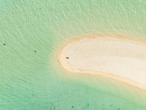 Aerial view of Malcapuya Island sandbar surrounded by crystal clear turquoise water in Coron Mimaropa Philippines. Aerial view of Malcapuya Island sandbar surrounded by crystal clear turquoise water in Coron Mimaropa Philippines.