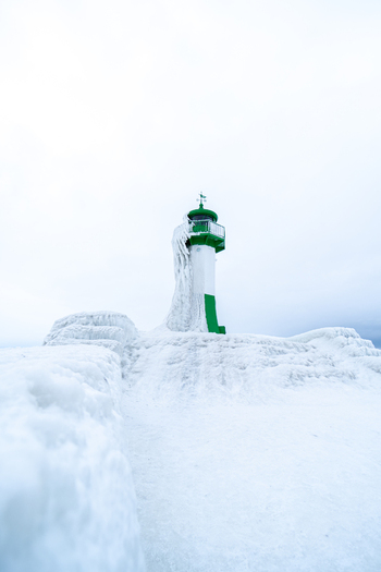 View of Molenfeuer Sassnitz covered in thick ice and snow during a cold winter day in Sassnitz Mecklenburg Vorpommern Germany.