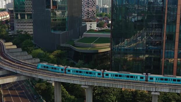 Aerial view of MRT train moving through Jakarta Indonesia.