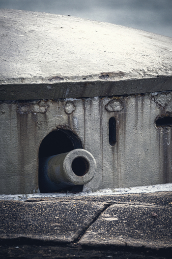 Rio de Janeiro Brazil 02 June 2026 View of a cannon barrel protruding from a weathered concrete bunker at the historic Copacabana Fort.
