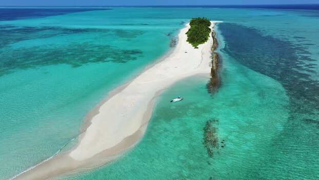 Aerial view of a tropical sandbar and turquoise water Maldives.