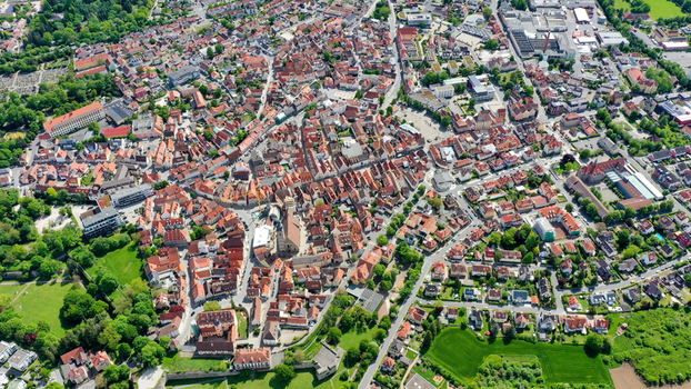 Aerial view of the historic old town with its traditional red tiled rooftops charming streets and lush green parks under bright sunlight in Forchheim Bavaria Germany. Aerial view of the historic old town with its traditional red tiled rooftops charming streets and lush green parks under bright sunlight in Forchheim Bavaria Germany.