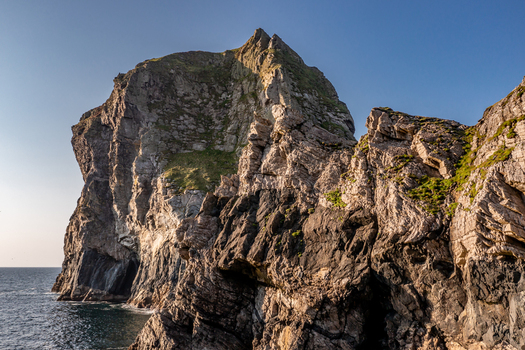 Aerial view of the rugged sea cliffs and rocky coastline at Glenlough Bay in Ardara County Donegal Ireland.