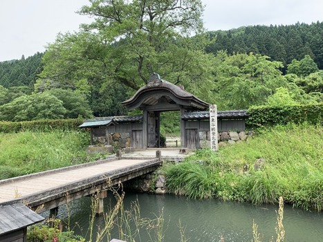 Japan 06 July 2026 View of the historic wooden gate at the Ichijodani Asakura Clan Ruins featuring a traditional bridge crossing a moat surrounded by lush greenery and dense forest in Japan. Japan 06 July 2026 View of the historic wooden gate at the Ichijodani Asakura Clan Ruins featuring a traditional bridge crossing a moat surrounded by lush greenery and dense forest in Japan.