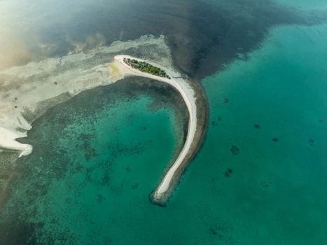Aerial view of Pungtud sandbank surrounded by turquoise waters and coral reefs in Panglao Philippines. Aerial view of Pungtud sandbank surrounded by turquoise waters and coral reefs in Panglao Philippines.
