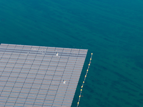 Aerial view of the floating solar system on Cottbuser Ostsee a former open pit mine undergoing repair works following storm damage in Cottbus Brandenburg Germany. Aerial view of the floating solar system on Cottbuser Ostsee a former open pit mine undergoing repair works following storm damage in Cottbus Brandenburg Germany.