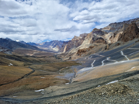 View of the winding Penzi La road through the rugged mountainous landscape of the Zanskar valley in Zanskar Ladakh India.