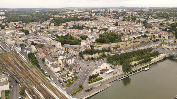 Aerial view of the historic town of Pontoise featuring dense urban architecture winding streets railway tracks and the Oise river waterfront in Pontoise Ile de France France. Aerial view of the historic town of Pontoise featuring dense urban architecture winding streets railway tracks and the Oise river waterfront in Pontoise Ile de France France.
