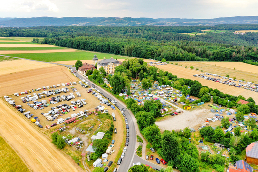 Eggolsheim Germany 09 May 2026 Aerial view of Schloss Jagersburg surrounded by an outdoor event with many parked cars and tents in the green fields of Eggolsheim Bayern. Eggolsheim Germany 09 May 2026 Aerial view of Schloss Jagersburg surrounded by an outdoor event with many parked cars and tents in the green fields of Eggolsheim Bayern.