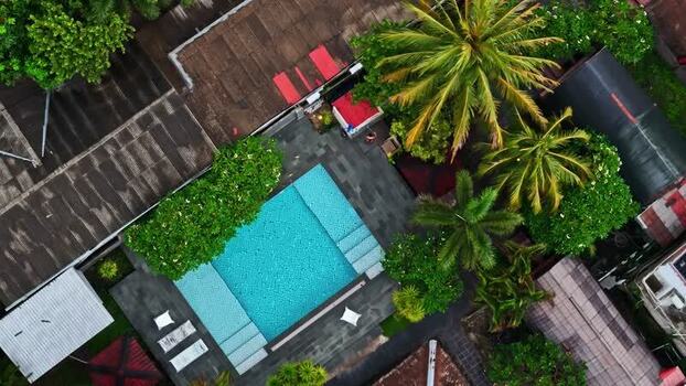 Aerial view of a turquoise swimming pool in Bali Indonesia.