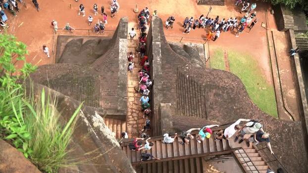 View of tourists climbing the stairs at Sigiriya Rock Sri Lanka.