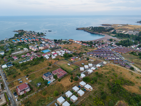 Aerial view of the coastal resort of Arapya with its small houses sandy beach and green landscape along the Black Sea coast in Burgas Bulgaria. Aerial view of the coastal resort of Arapya with its small houses sandy beach and green landscape along the Black Sea coast in Burgas Bulgaria.