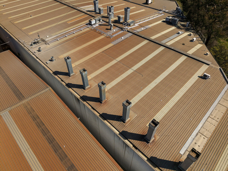 Aerial view of industrial factory roof with ventilation stacks and HVAC units in Kilsyth Victoria Australia. Aerial view of industrial factory roof with ventilation stacks and HVAC units in Kilsyth Victoria Australia.