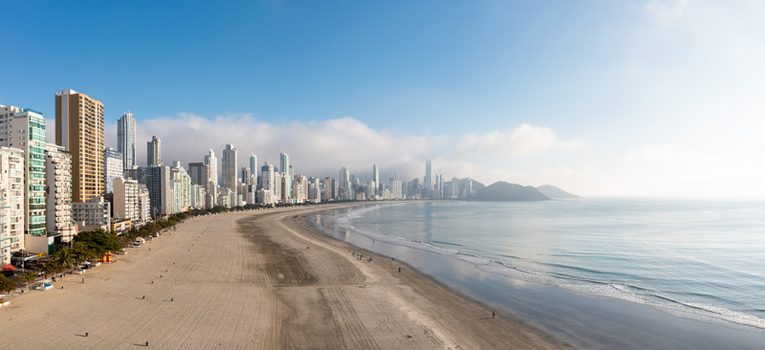 Aerial view of the modern skyline and sandy beach of Praia Central under a clear blue sky in Balneario Camboriu State of Santa Catarina Brazil. Aerial view of the modern skyline and sandy beach of Praia Central under a clear blue sky in Balneario Camboriu State of Santa Catarina Brazil.