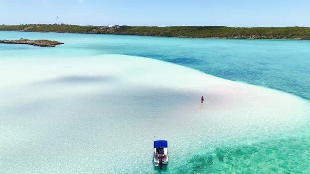 Aerial view of Man O War Cay Sandbar and blue waters The Bahamas.
