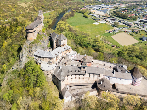 Aerial view of Orava Castle perched on a high rock above the Orava river surrounded by lush green forests and rolling hills Dolny Kubin Zilinsky kraj Slovakia. Aerial view of Orava Castle perched on a high rock above the Orava river surrounded by lush green forests and rolling hills Dolny Kubin Zilinsky kraj Slovakia.