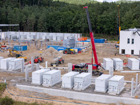 Aerial view of the Zarnowiec pumped storage power plant construction site with energy storage containers cranes and heavy machinery in Wejherowo County Pomeranian Voivodeship Poland.