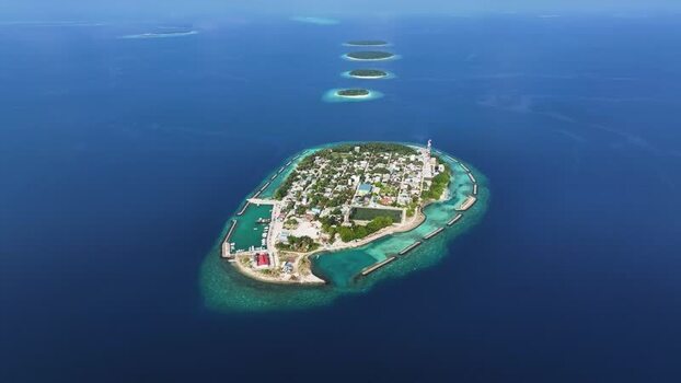 Aerial view of Kendhoo island with coral reefs and turquoise water Maldives. Aerial view of Kendhoo island with coral reefs and turquoise water Maldives.