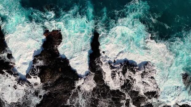 Aerial view of waves crashing on Kalaemamo rocks United States.