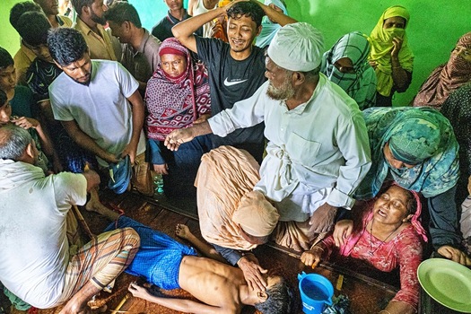Banshkhali Upazila Chittagong Division Bangladesh 10 July 2026 View of a grieving family surrounding a young child lying on the floor in a room with people crying and showing deep sorrow. Banshkhali Upazila Chittagong Division Bangladesh 10 July 2026 View of a grieving family surrounding a young child lying on the floor in a room with people crying and showing deep sorrow.