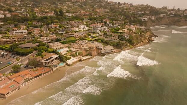 Aerial view of La Jolla Cove coastline and surfers United States.