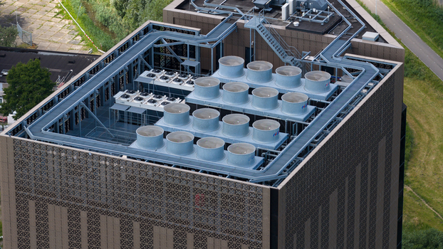 Amsterdam Netherlands 09 June 2026 Aerial view of Digital Realty Amsterdam AMS17 data center rooftop featuring large industrial cooling fans and complex ventilation infrastructure. Amsterdam Netherlands 09 June 2026 Aerial view of Digital Realty Amsterdam AMS17 data center rooftop featuring large industrial cooling fans and complex ventilation infrastructure.