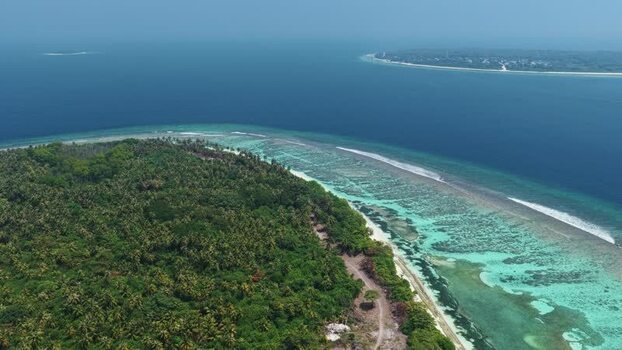 Aerial view of Vaikaradhoo island in the Maldives. Aerial view of Vaikaradhoo island in the Maldives.