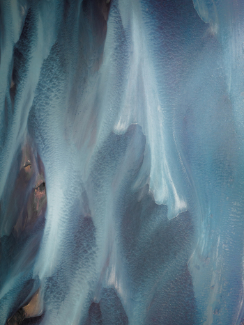 Aerial view of glacial rivers carving through Iceland s stark landscape their icy blue waters creating mesmerizing patterns against the dark earth Iceland Iceland. Aerial view of glacial rivers carving through Iceland s stark landscape their icy blue waters creating mesmerizing patterns against the dark earth Iceland Iceland.