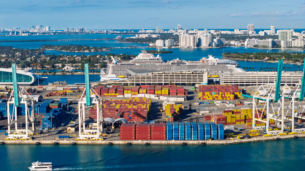 Miami United States 09 February 2026 Aerial view of PortMiami with large cruise ships colorful shipping containers industrial cranes and the Miami skyline in the background.