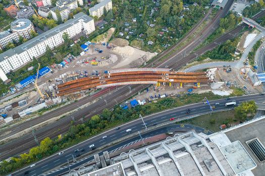 Aerial view of the Ringbahnbrucke bridge construction site at the Funkturm interchange with steel girders railway tracks and highway traffic in Berlin Berlin Germany. Aerial view of the Ringbahnbrucke bridge construction site at the Funkturm interchange with steel girders railway tracks and highway traffic in Berlin Berlin Germany.