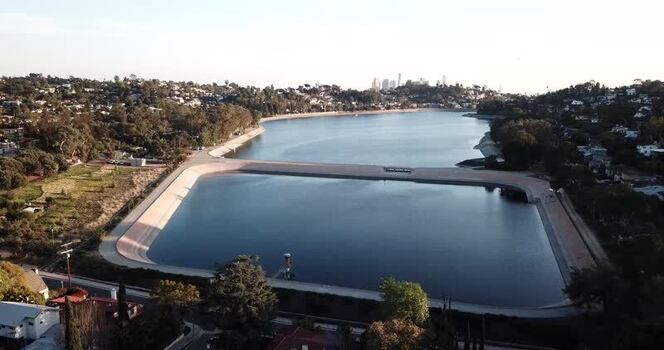 Aerial view of Silver Lake Reservoir and city skyline United States. Aerial view of Silver Lake Reservoir and city skyline United States.