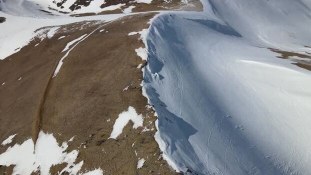 Aerial view of the Moskardshnjukar Trail on a snowy mountain ridge Iceland. Aerial view of the Moskardshnjukar Trail on a snowy mountain ridge Iceland.