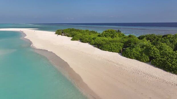 Aerial view of the white sand beach and turquoise lagoon Maldives. Aerial view of the white sand beach and turquoise lagoon Maldives.