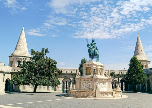 View of the equestrian statue of Saint Stephen at Fisherman s Bastion with its iconic neo Romanesque turrets and cobblestone courtyard in Budapest Hungary. View of the equestrian statue of Saint Stephen at Fisherman s Bastion with its iconic neo Romanesque turrets and cobblestone courtyard in Budapest Hungary.