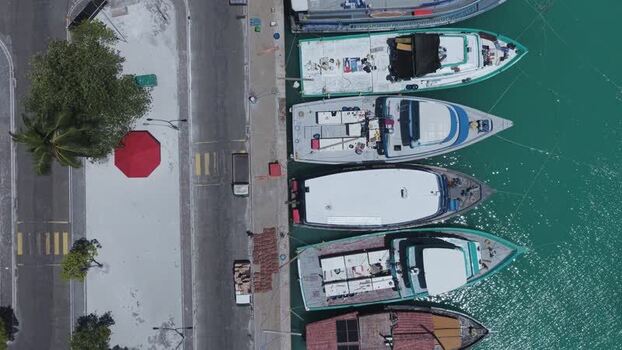 Aerial view of boats moored at the harbor in Kudahuvadhoo Maldives.