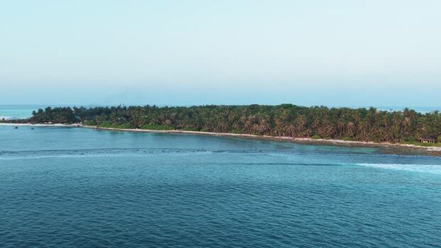 Aerial view of the tropical island of Kudahuvadhoo Maldives. Aerial view of the tropical island of Kudahuvadhoo Maldives.