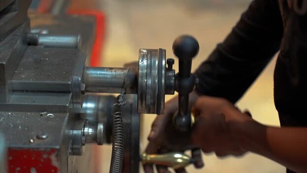 View of a worker operating a lathe machine Bangladesh. View of a worker operating a lathe machine Bangladesh.