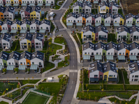 Aerial view of the modern Residential Park Lozen complex featuring colorful houses manicured lawns and a winding road in Sofia Sofia City Province Bulgaria. Aerial view of the modern Residential Park Lozen complex featuring colorful houses manicured lawns and a winding road in Sofia Sofia City Province Bulgaria.